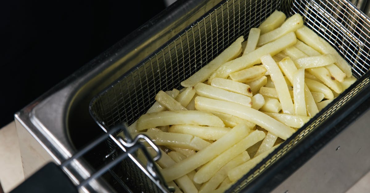 Deep frying vs air frying temperature equivalence - Close-Up Shot of Deep Frying French Fries