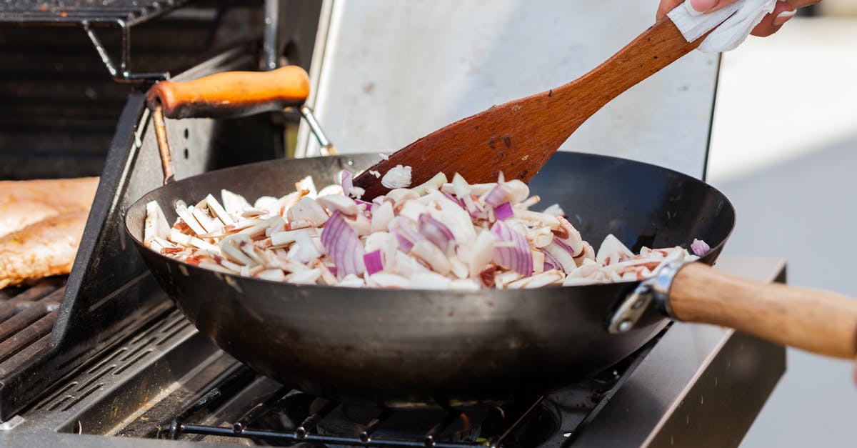 Deep Saute Pan vs Stockpot - A Person Cooking using Stove