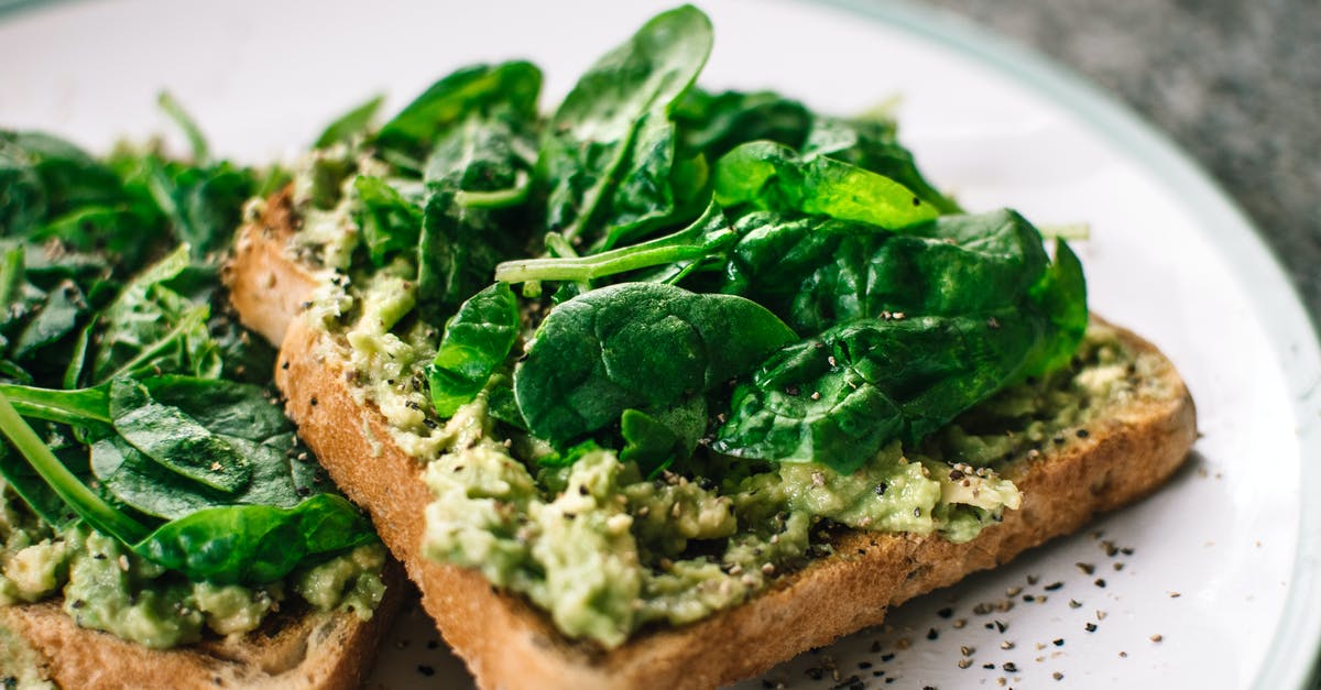 defrosting homemade frozen bread - Basil Leaves and Avocado on Sliced Bread on White Ceramic Plate