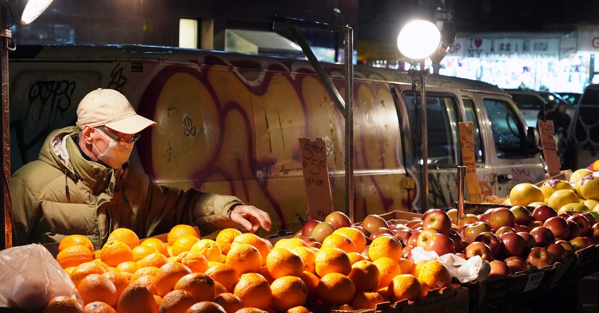 Dehydrating fruit/veg, temperature, and safety - Woman in Brown Hat Holding Orange Fruits