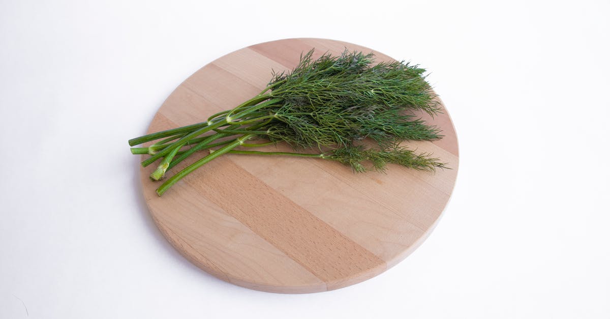 Dehydrating herbs - leaves vs. stems - A Bunch of Dill on Wooden Chopping Board