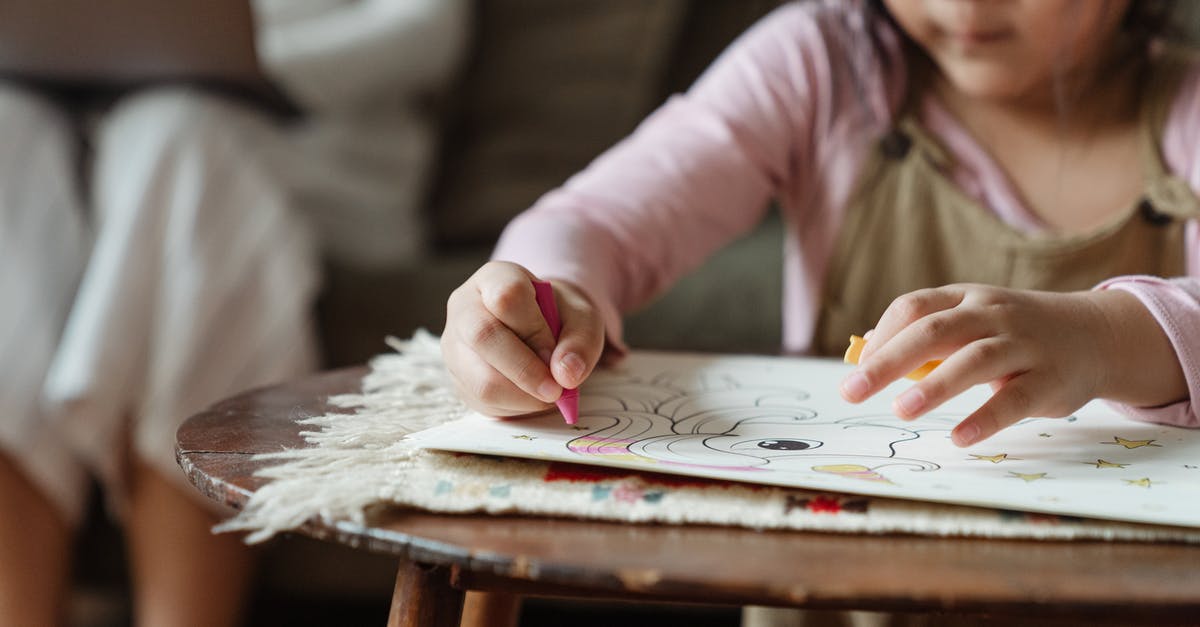 Dehydrating Strawberries - Wax Paper or Parchment? - Crop girl coloring drawing with wax pencils at coffee table