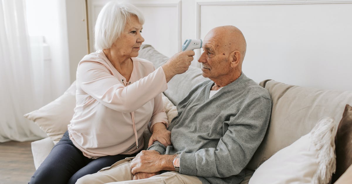 Dehydration temperatures for long-term preservation - Woman Checking the Temperature of a Man