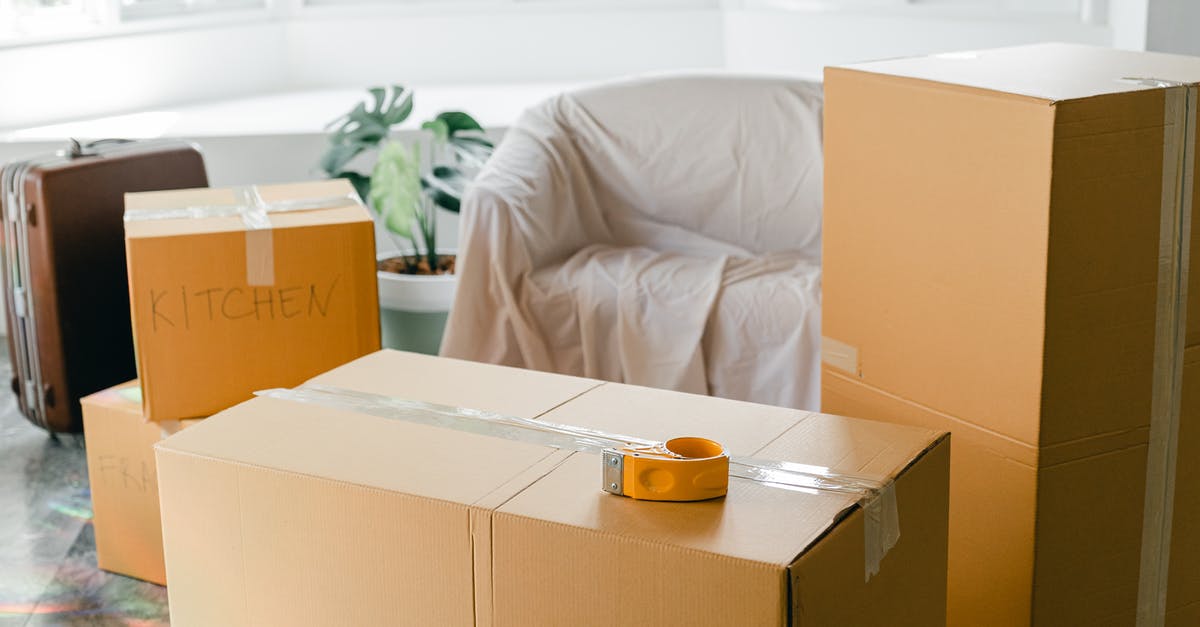 Difference between freezer bag and storage bag - Empty apartment with packed carton boxes before moving