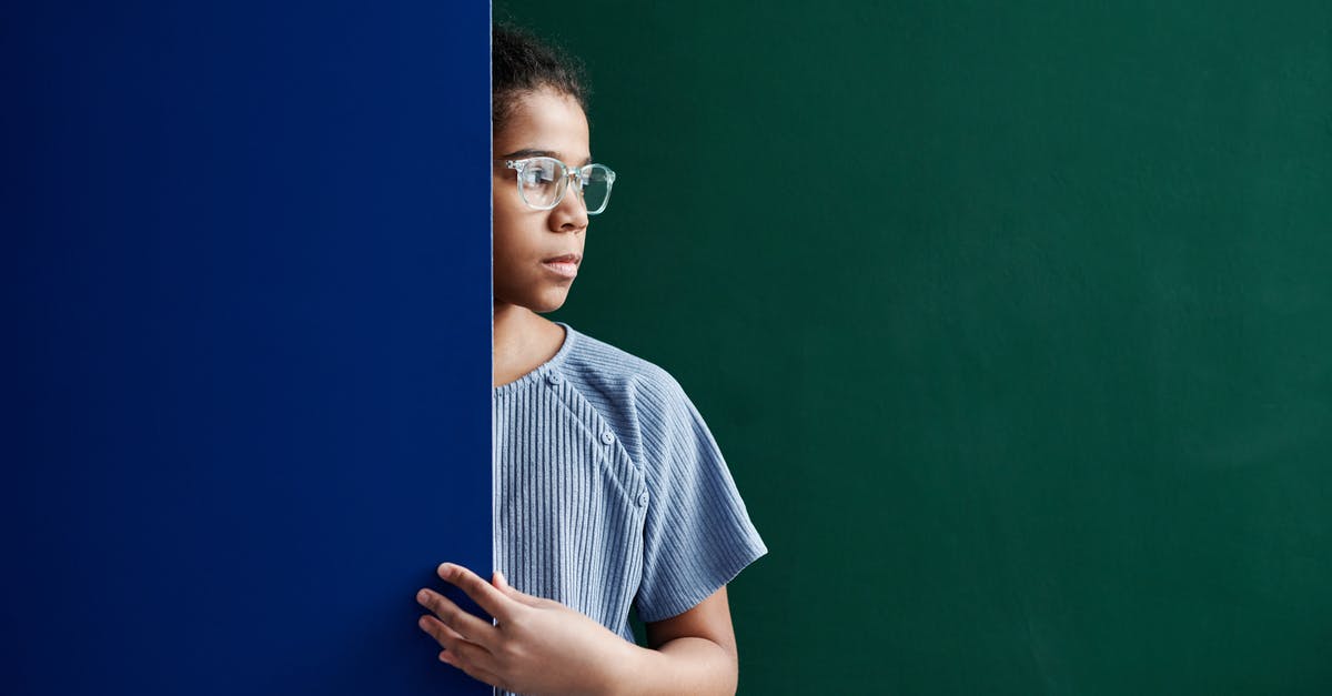 Difference between sweating and sautéeing? - A Woman in Blue Shirt Standing Between Green and Blue Wall