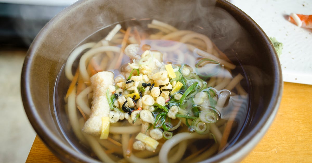 Dispensing fair shares of inhomogeneous soup - Noodle Soup With Sliced Vegetables in Black Ceramic Bowl