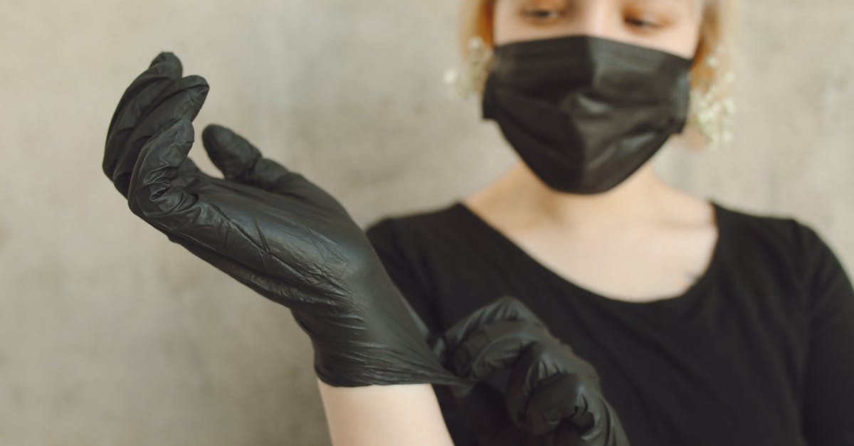 Disposable cookware - Woman in Black Long Sleeve Shirt Wearing Black Mask