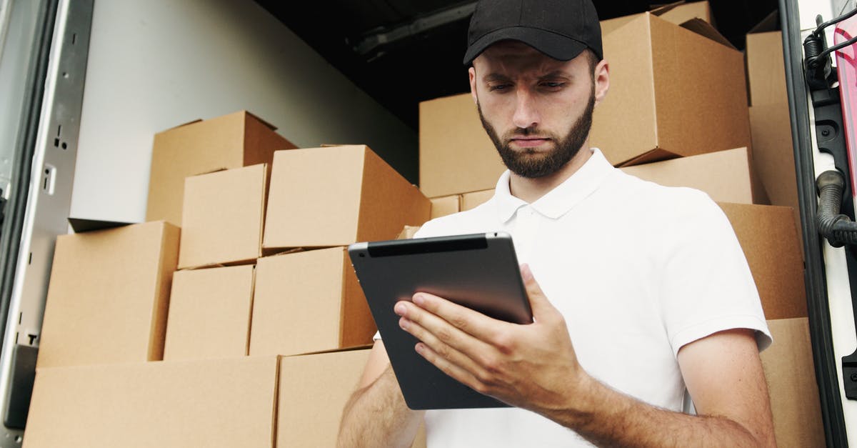 Distribution of heat using a silicone oven tray - Man in White Polo Shirt Using a Tablet Computer