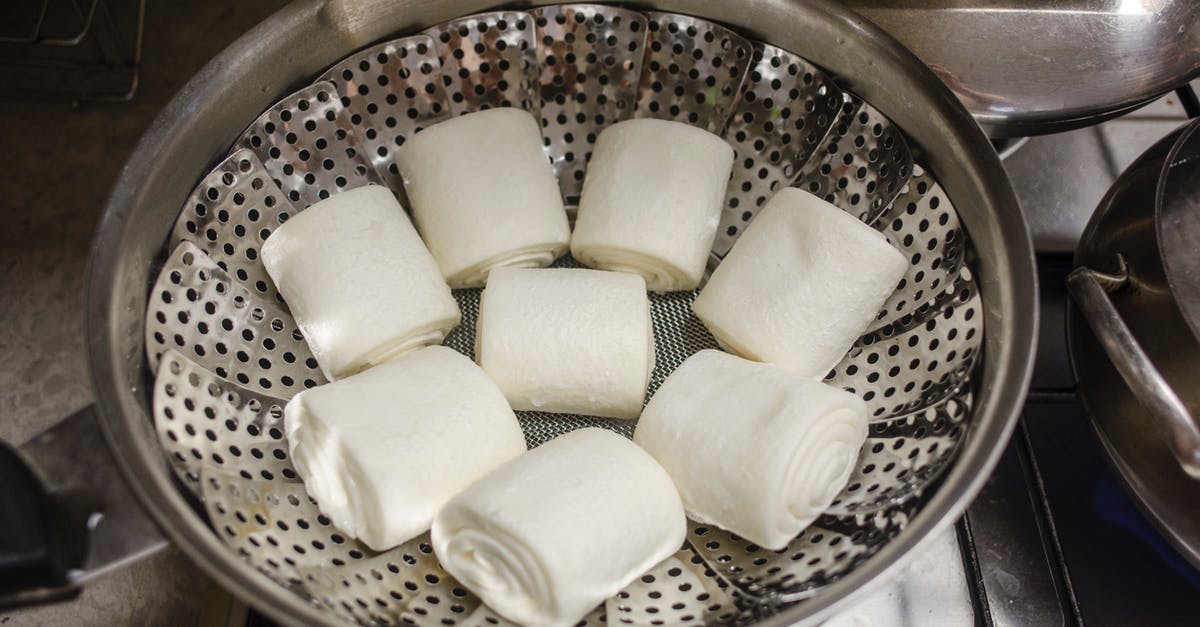 Dividing dough into rolls - Rolls of Dough on a Steamer