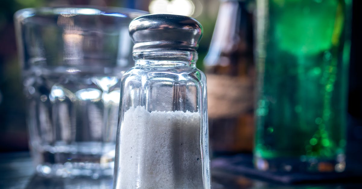 Do alcohol and salt help in preservation of dehydrated vegetables? - Selective Focus Photography of Clear Glass Condiment Shaker