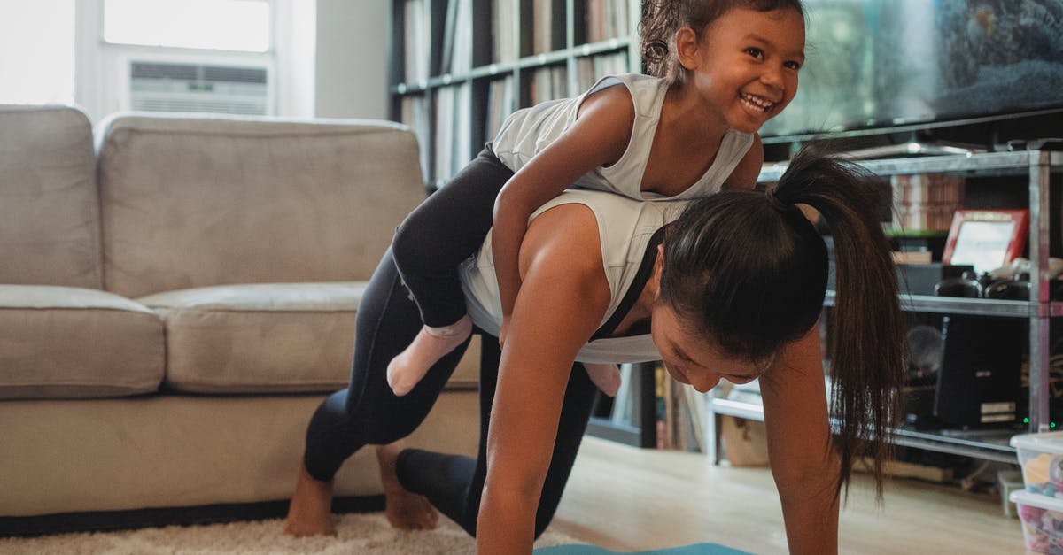 Do all yogurts have live active cultures? - Young Asian woman piggybacking smiling daughter while exercising at home