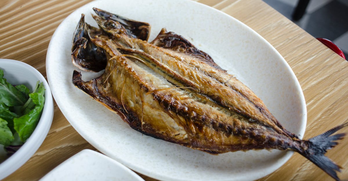 Do both large and small fish bones soften with pressure cooking? - A Half Fried Fish on a Dish Plate