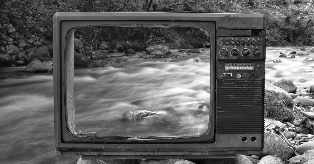 Do centrifugal juicers destroy vitamins through friction? - Black and white vintage old broken TV placed on stones near wild river flowing through forest