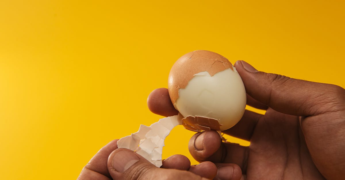 Do eggshells let flavours pass through during boiling? - Person Removing Egg Shell 