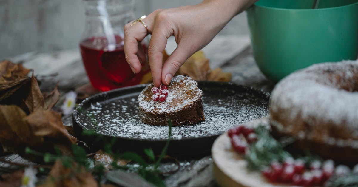 Do extracts add sweetness or just the flavor? - Crop faceless housewife decorating pie slice with red currant