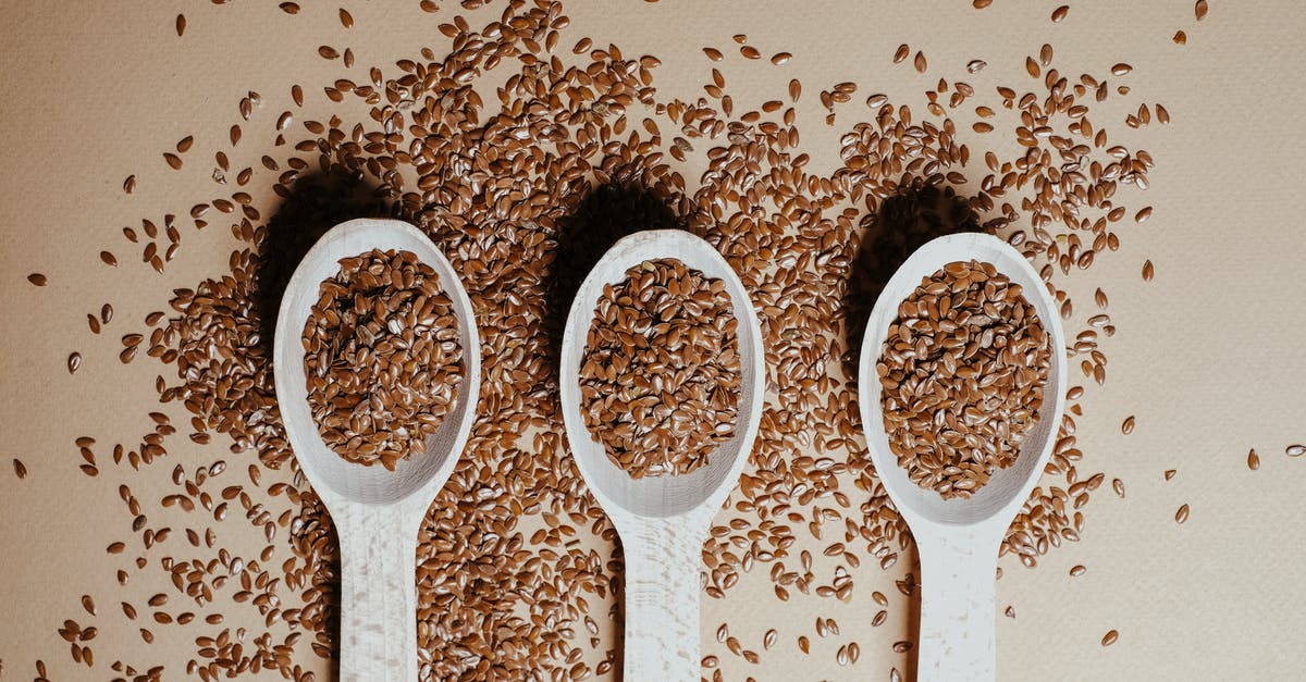 Do flax seeds lose their fiber if cooked? - Three Wooden Spoons with Flax Seeds