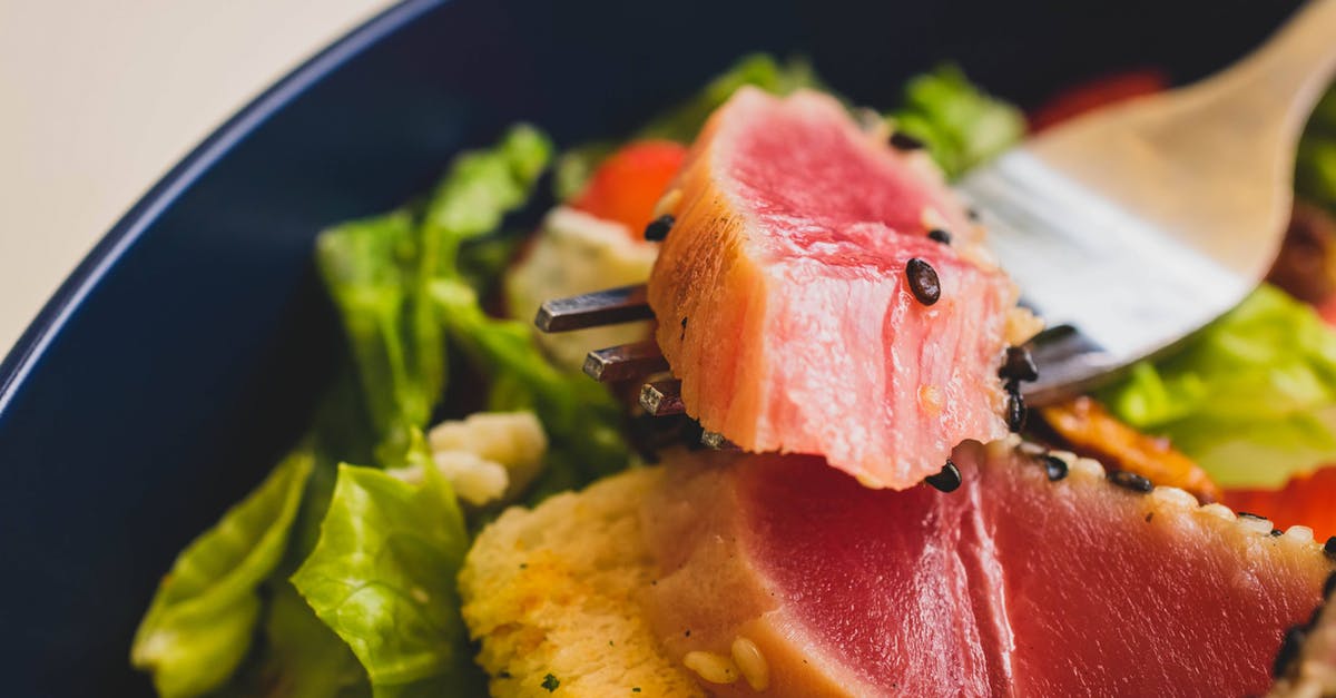 Do frozen ahi tuna steaks need to be seared? - Salad  with Ahi Tuna on Blue Ceramic Plate