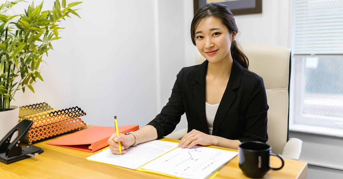 Do German or Japanese knives hold their edge longer? - Woman in Black Blazer Sitting at the Table