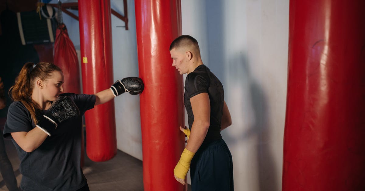 Do I need special gloves for mozzarella stretching? - Woman Hitting the Red Punching Bag