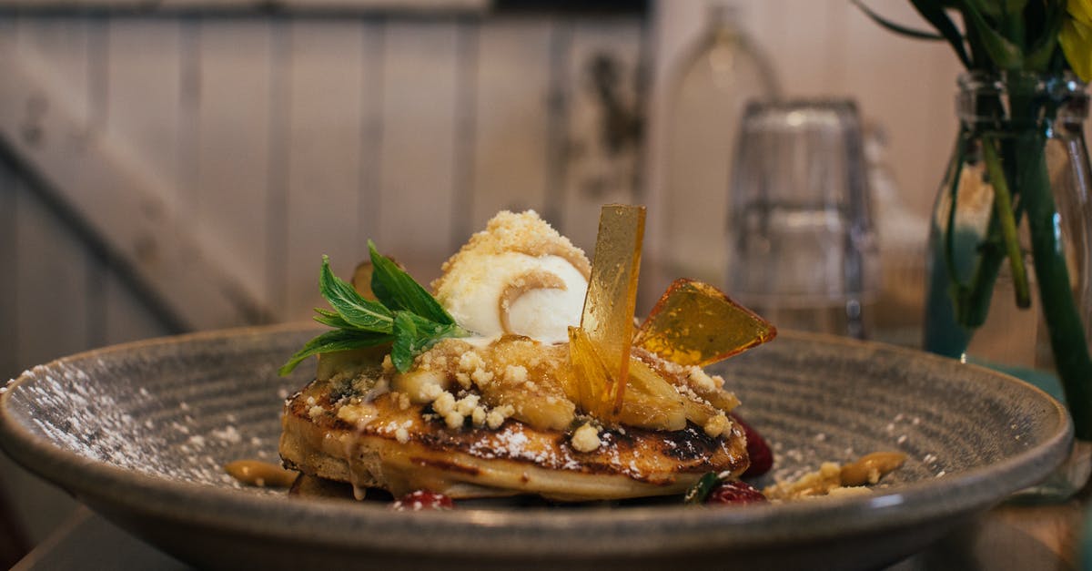 Do I use pure glucose or sugar syrup for making a caramel filling for a cookie? - Delicious pancaked with caramel and syrup served on plate with ice cream scoop and decorated with fresh mint leaves in cafe