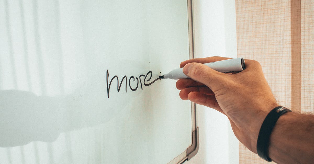 Do more peppers mean more heat? - Crop unrecognizable man writing more word with marker on whiteboard during creating new startup in light workplace