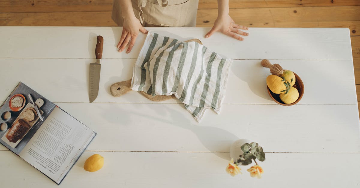 Do Morrocan-stye pickled lemons really need 5 to 10% salt? - Person in Gray Long Sleeve Shirt Holding White and Gray Stripe Textile