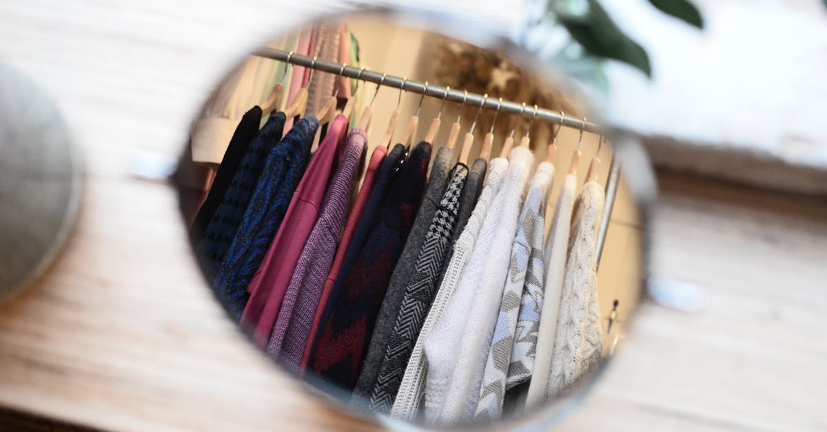 Do onion savers differ from other storage methods? - Clothes hanging on rack in reflection of mirror