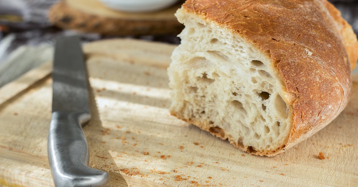 Do plastic cutting boards dull knives faster than wood boards? - Sliced Bread and Stainless Steel Knife on Top of Brown Wooden Chopping Board