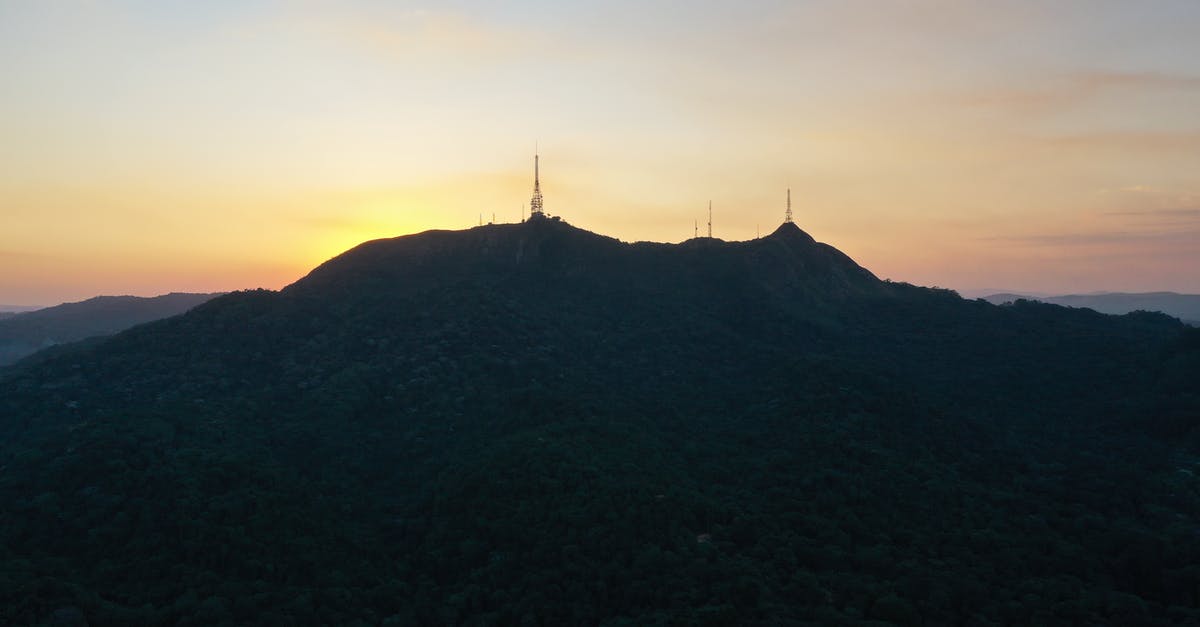 Do quiet induction burners exist? - Picturesque scenery of silhouette of Pico do Jaragua mountain with TV towers located in Sao Paulo against sunset sky