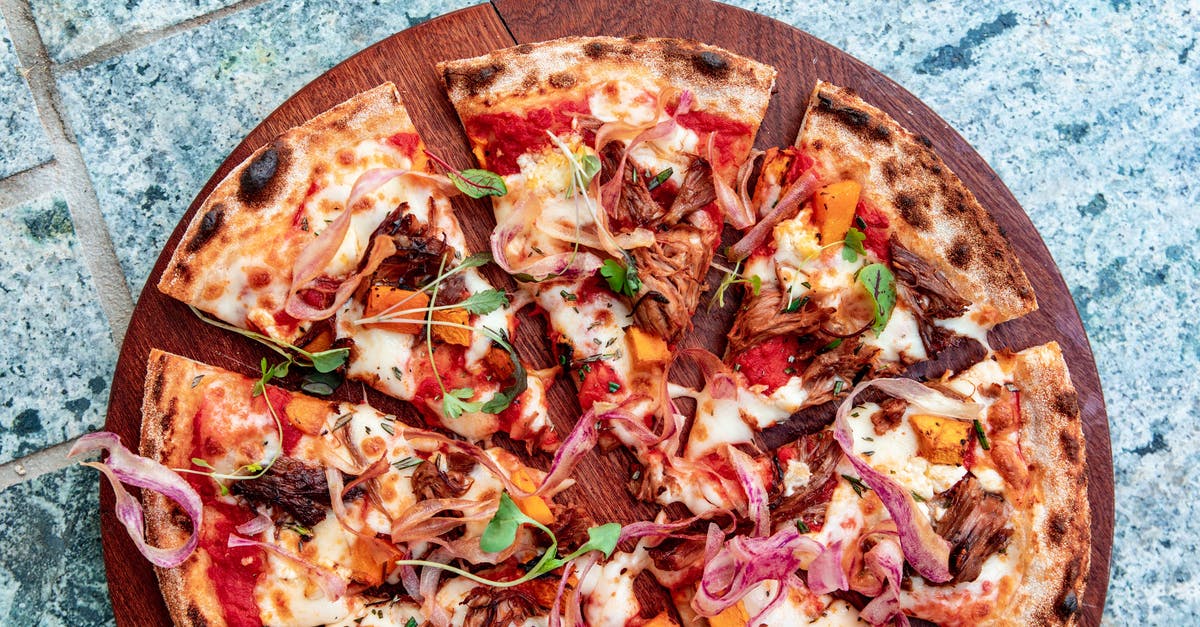 Do you need to rinse vegetables that can be peeled? - Top View of a Sliced Pizza