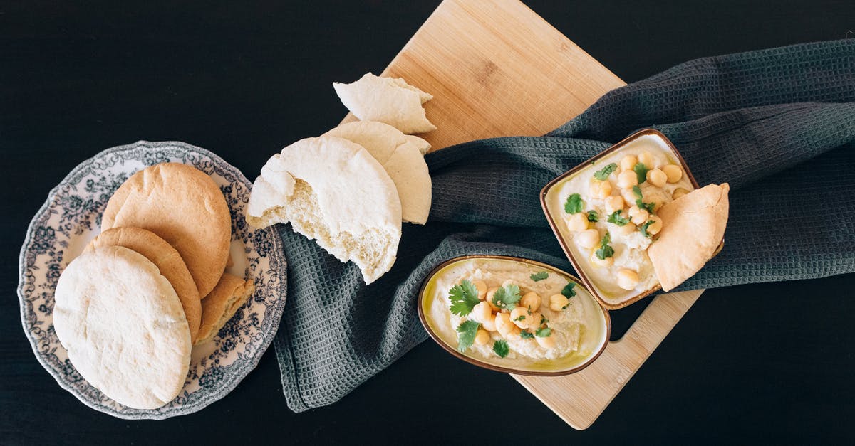 Do you peel garbanzo beans for hummus? - Photo of Hummus and Bread on Top of a Chopping Board