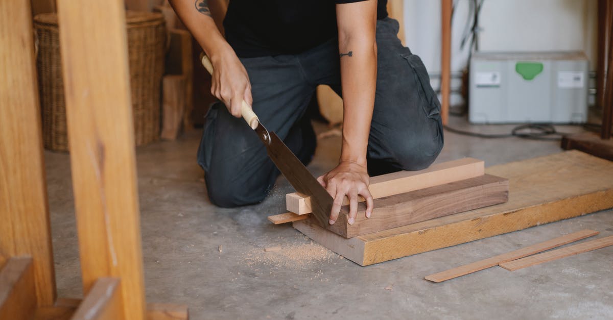 Does a silicone cutting board really work well? - Crop man cutting wood in workshop