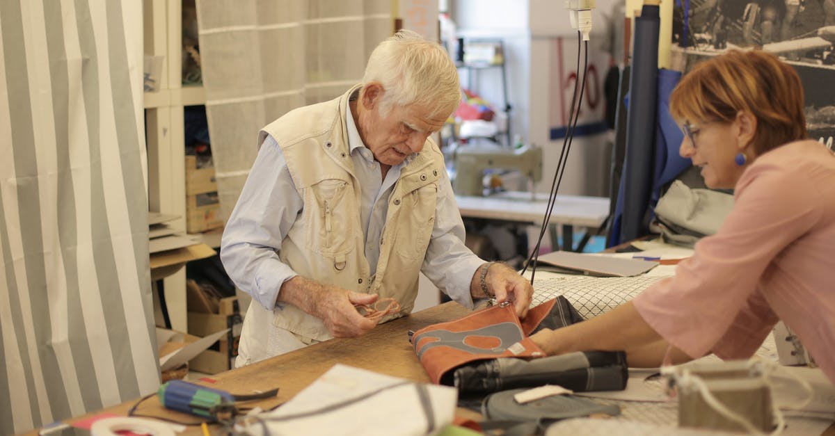 does a tool like air bag opener exist for paper bag application? - Aged craftsman making leather bag in workshop with assistant does a tool like air bag opener exist for paper bag application? - Aged craftsman making leather bag in workshop with assistant