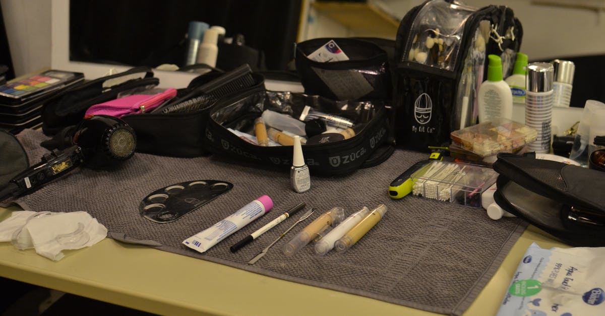 does a tool like air bag opener exist for paper bag application? - From above of hair dryer and cosmetic bags with various makeup supplies and products placed on table in dressing room does a tool like air bag opener exist for paper bag application? - From above of hair dryer and cosmetic bags with various makeup supplies and products placed on table in dressing room