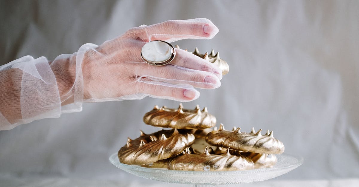 Does an acid actually stabilize meringue and if so why? - Person Holding Brown Wooden Tray With Gold Ring