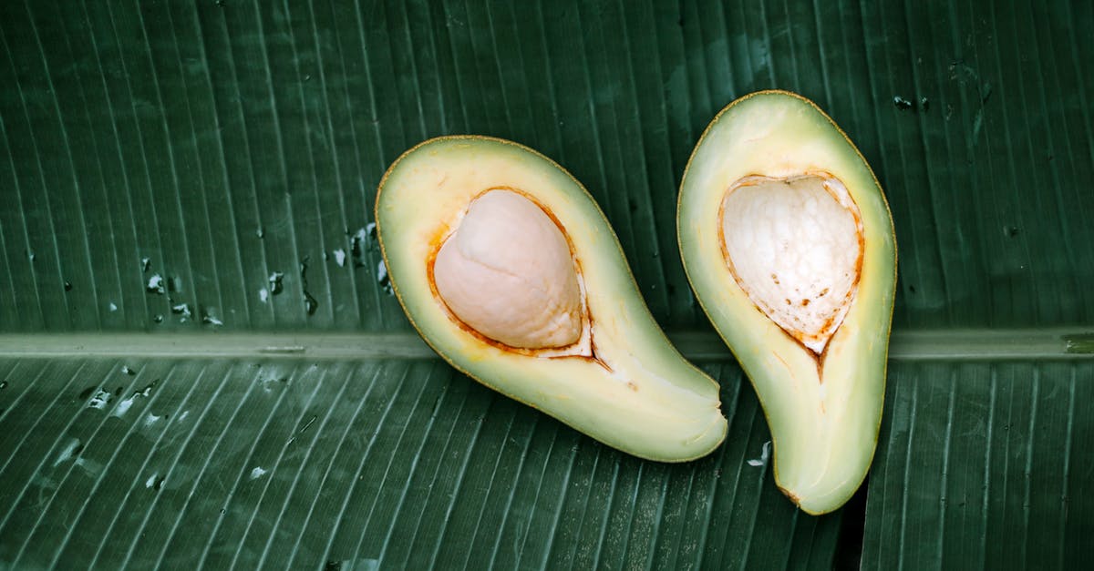 Does an avocado seed help guacamole stay green? - Sliced Avocado Fruit on A Banana Leaf