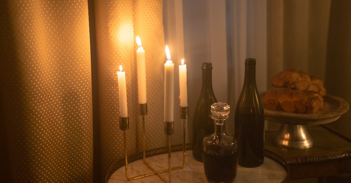 Does any other cultures have a food similar to jewish Chulent? - Lighted Candles And Wine Bottles on Wooden Table