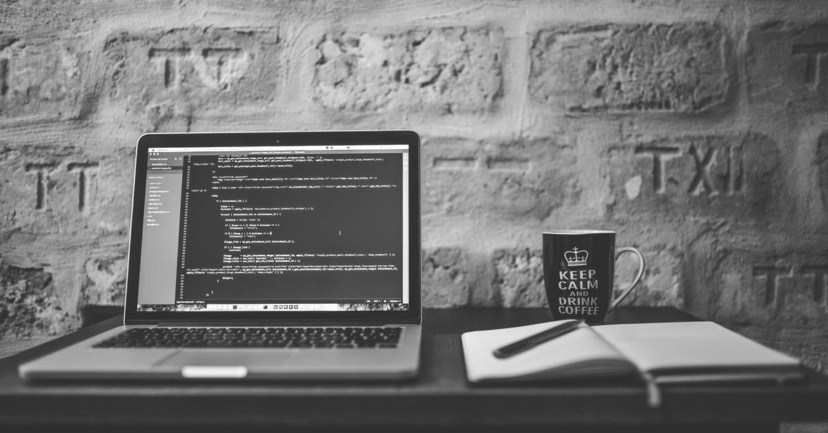 Does anyone know what it is in my apple cider vinegar? - Grayscale Photo of Computer Laptop Near White Notebook and Ceramic Mug on Table