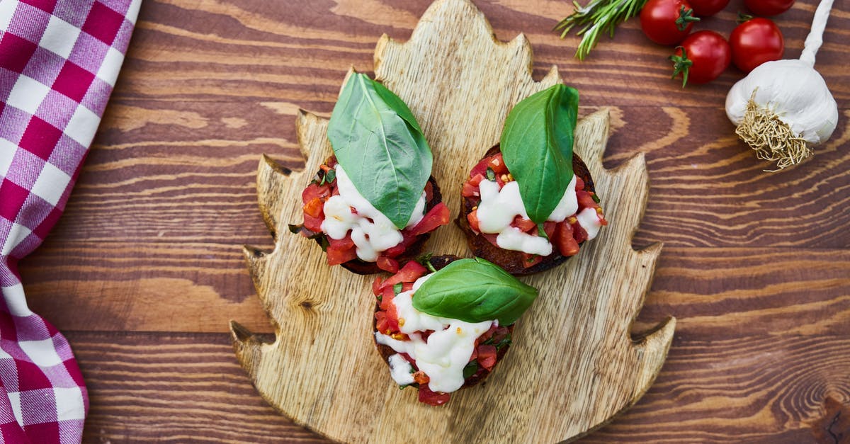 Does Boursin cheese always contain garlic? - Three Tomato Dishes on Brown Wooden Chopping Board