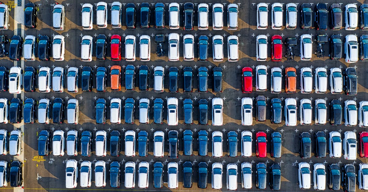 Does burnt mark on cast iron crepe machine mean it’s ruined? - Drone view of various modern vehicles parked on marked parking lot in sunlight