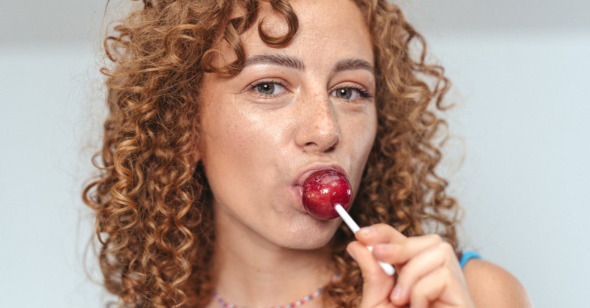 Does candy expire? - Woman in Blue Tank Top With Red Lipstick