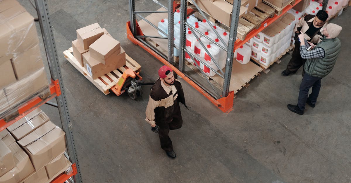 Does canning stock raise its temperature too high? - Men Working in a Warehouse