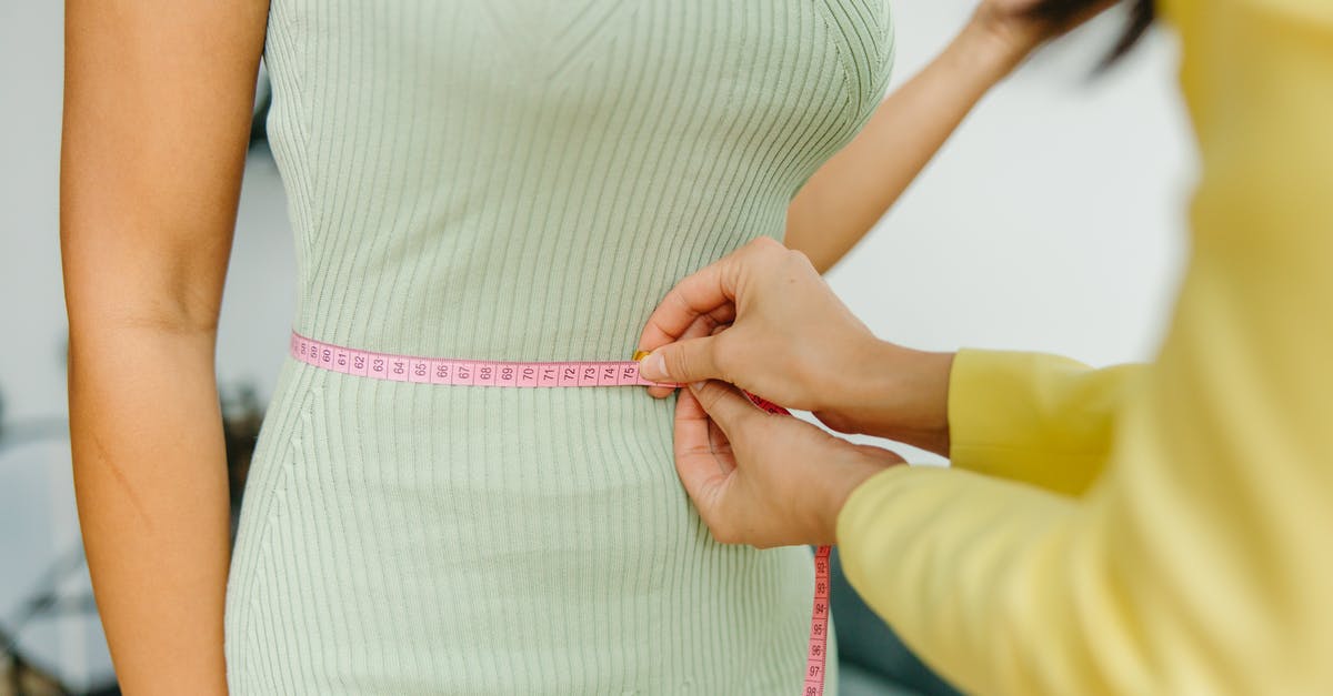 Does cooking food destroy BPA? - Woman in White and Pink Stripe Dress Holding Pink Strap