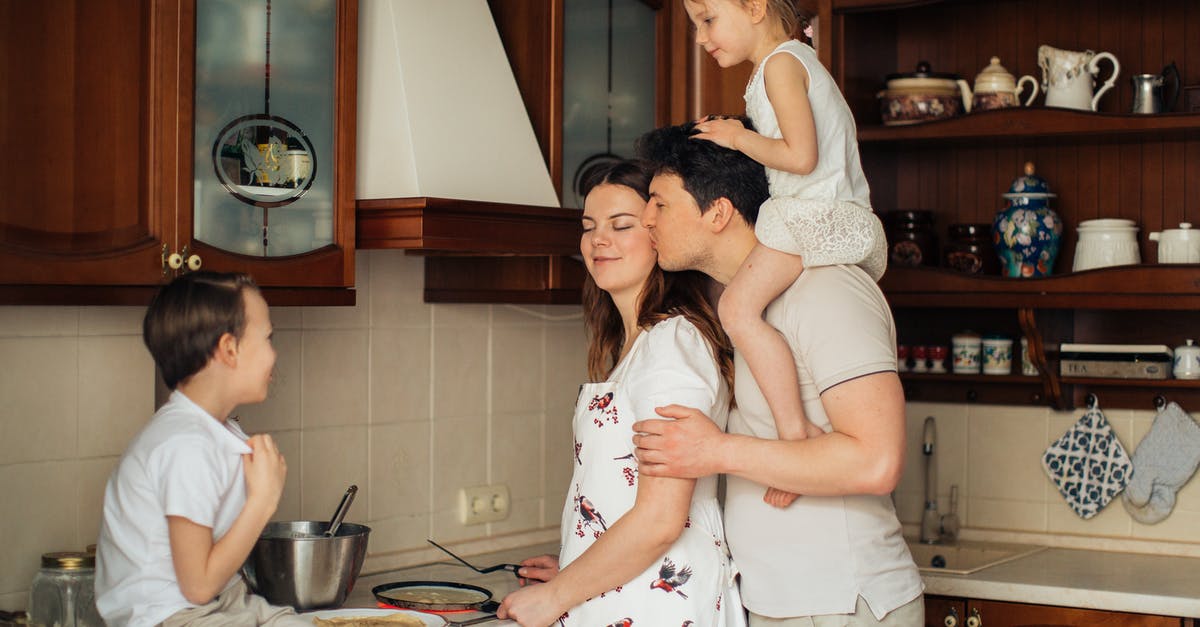 Does cornstarch affect the pH of what I'm cooking? - Photo of Man Kissing His Wife While Cooking