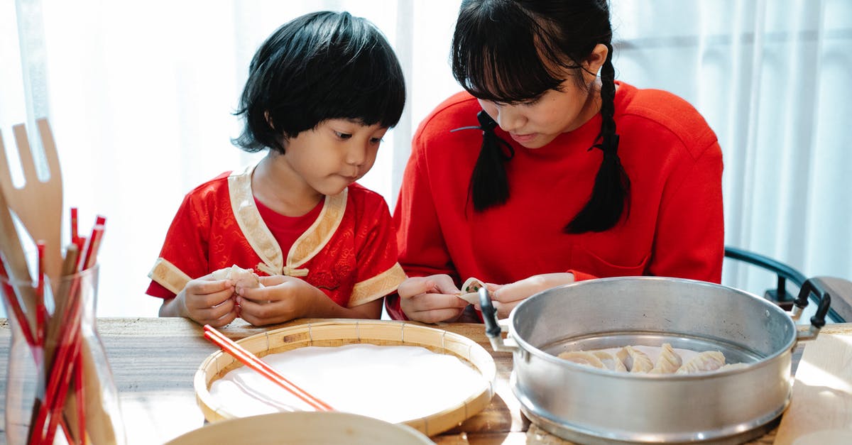 Does food steamer require ventilation - Asian teen sister teaching brother to cook dumplings