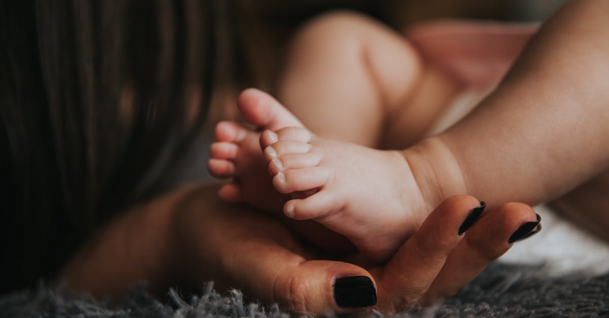 Does freezing non-freezable liquids affect life span - Person Holding Baby's Feet in Selective Focus Photography