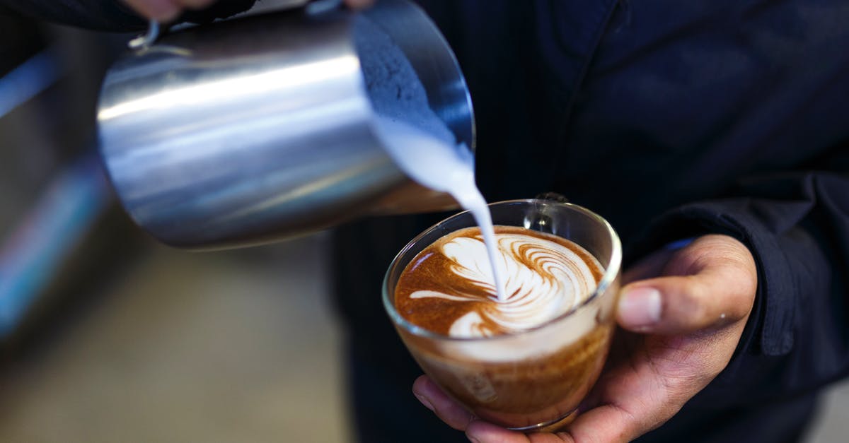 Does full-fat milk contain Vitamin-D? - Person Pouring Milk on Coffee