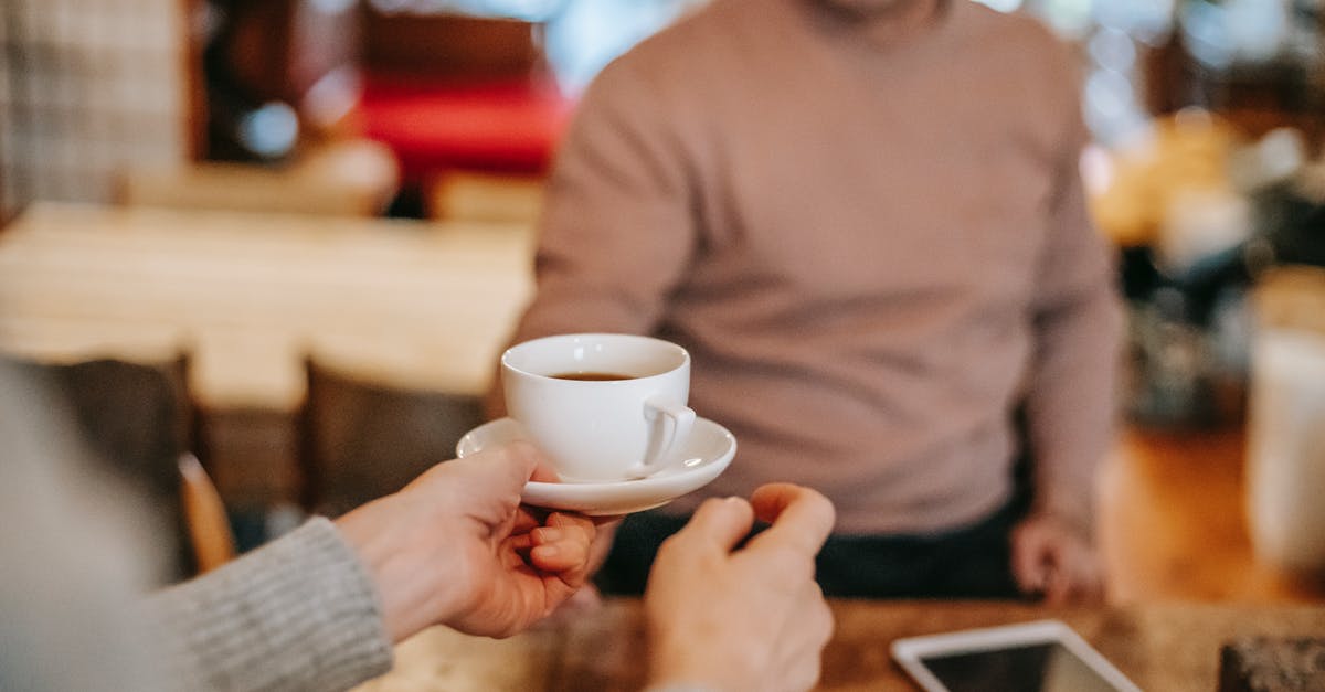Does it take more energy to maintain a higher cooking temperature? - Crop couple having breakfast together with coffee at home Does it take more energy to maintain a higher cooking temperature? - Crop couple having breakfast together with coffee at home