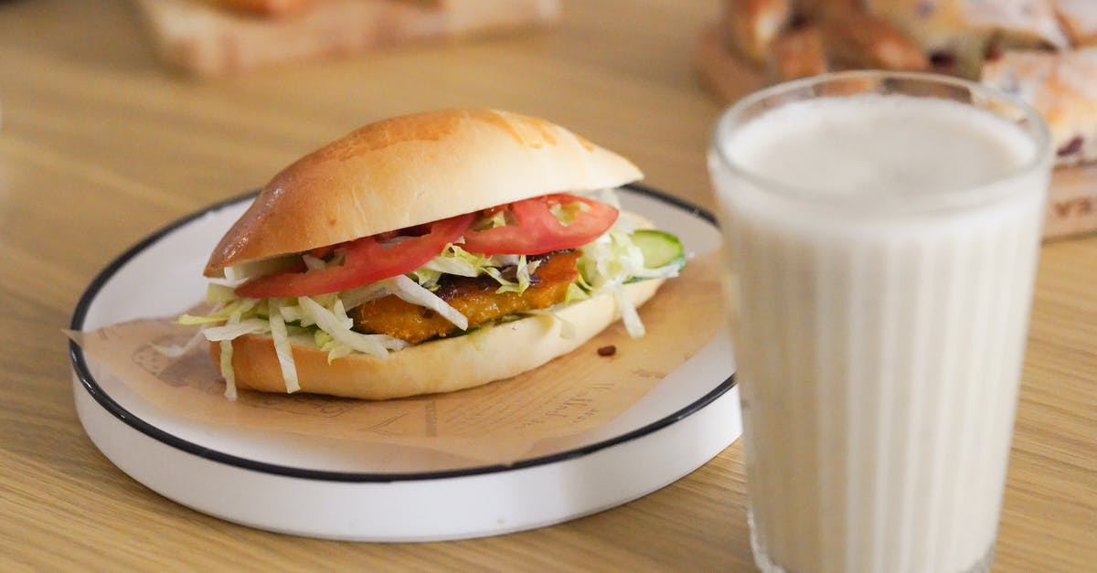 Does milk tenderize meat? - Burger and Glass of Milk on Table