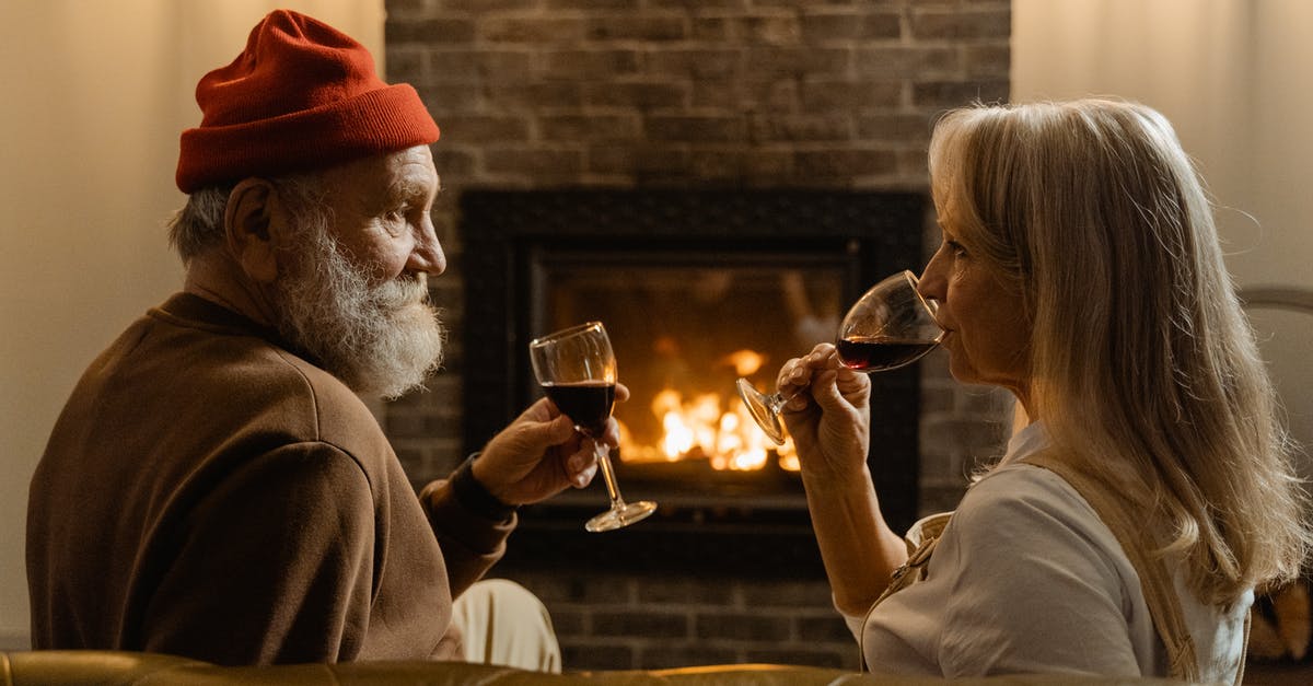 Does oak aged wine contain vanillin? - Man and Woman Holding Wine Glasses